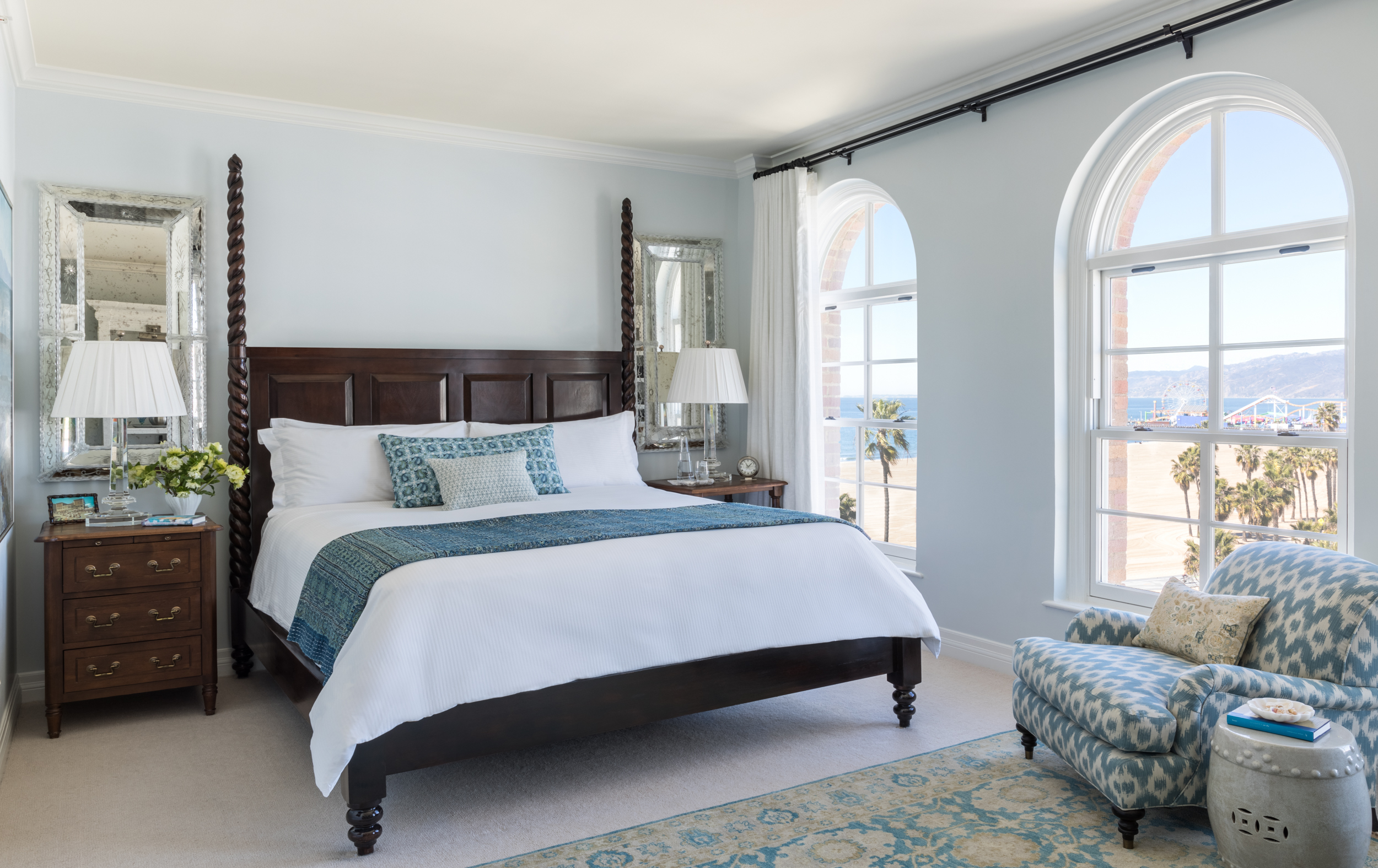 king bed with windows looking out at the santa monica pier