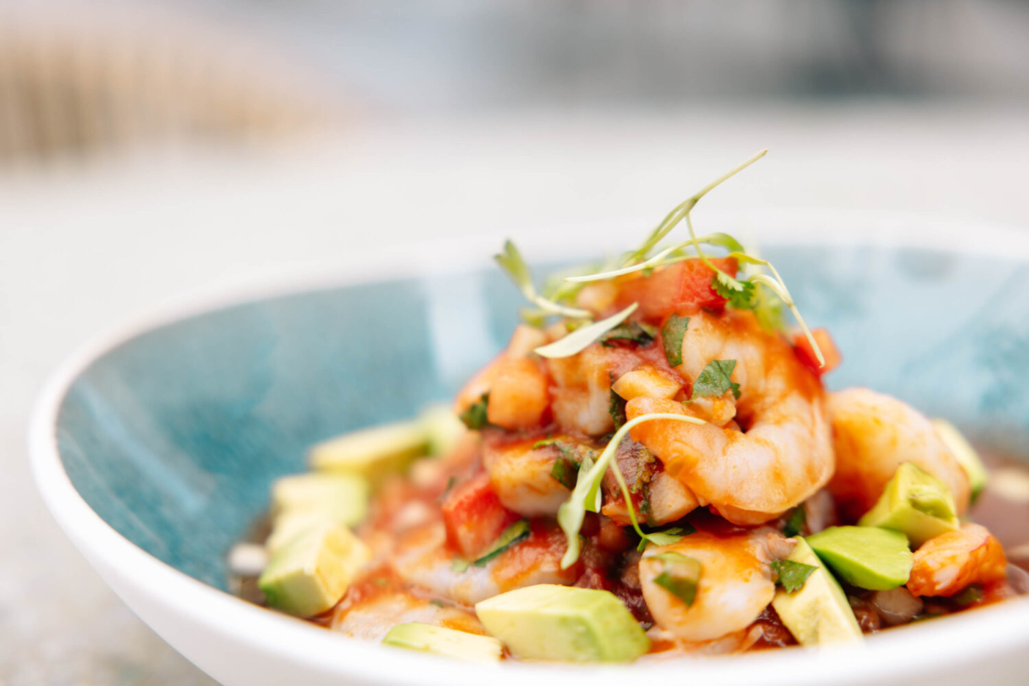 up close shot of a bowl of a shrimp dish